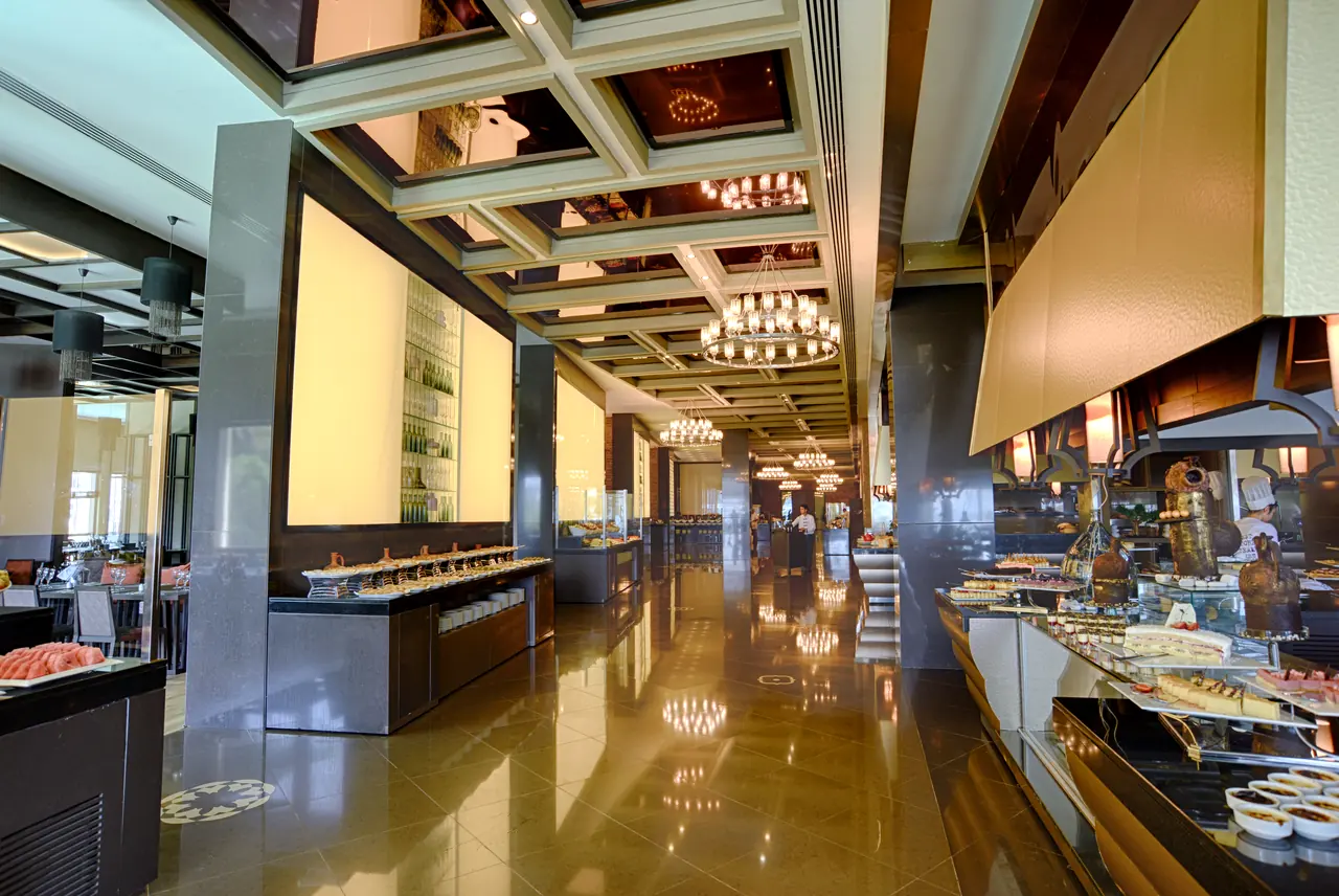 Rixos Premium Belek — Buffet axis with coffered ceiling and chandeliers